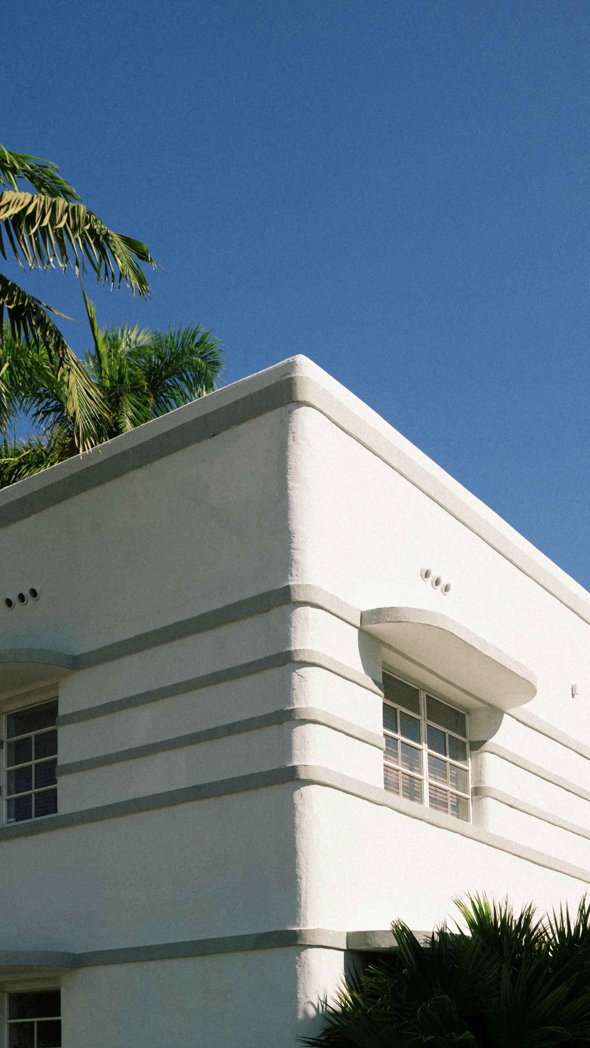 Streamline Moderne Art Deco facade, South Beach, palm shadow