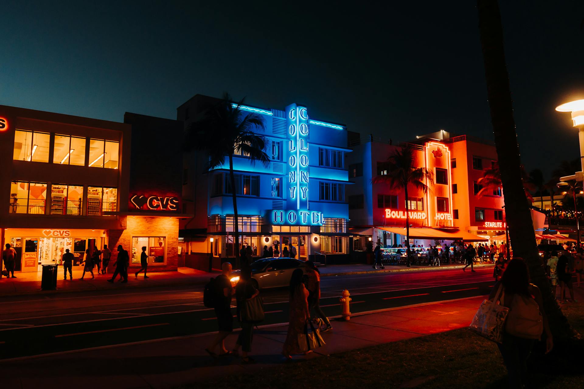 Ocean Drive at night with neon signs of Colony Hotel and Boulevard Hotel